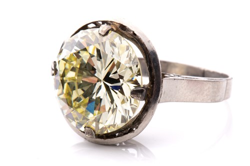 Lot 227 - A diamond solitaire ring, featuring a light...