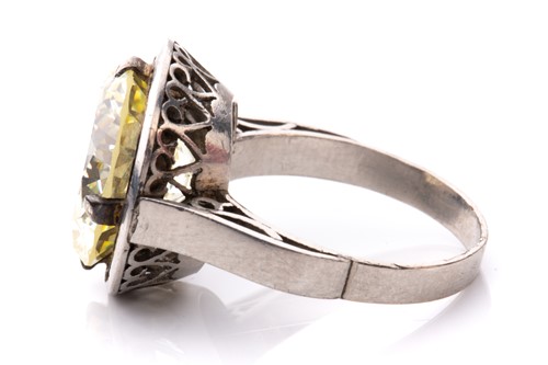 Lot 227 - A diamond solitaire ring, featuring a light...