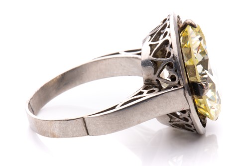 Lot 227 - A diamond solitaire ring, featuring a light...
