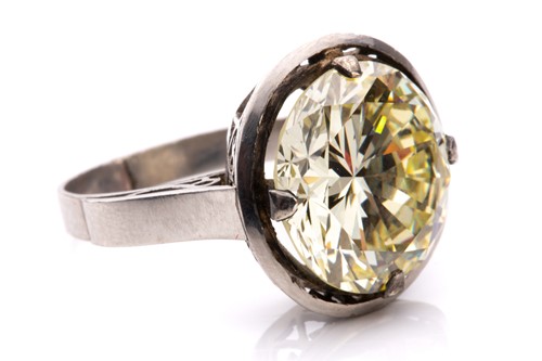 Lot 227 - A diamond solitaire ring, featuring a light...