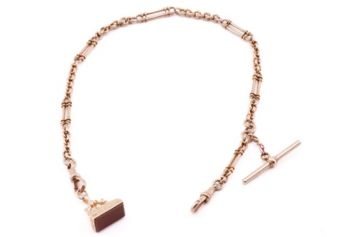 Lot 73 - A 9ct pink gold Albert chain with fob seal,...