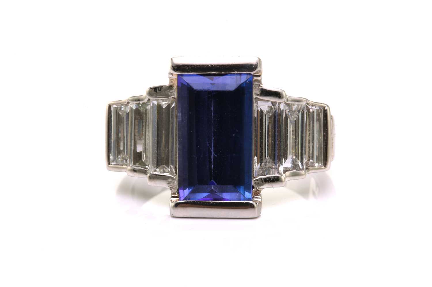 Lot 21 - An Art Deco-style platinum tanzanite and...