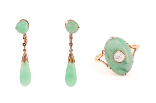Lot 27 - A jade and diamond ring, the oval jade...