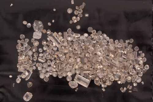 Lot 64 - A melee of mixed cut loose diamonds including...