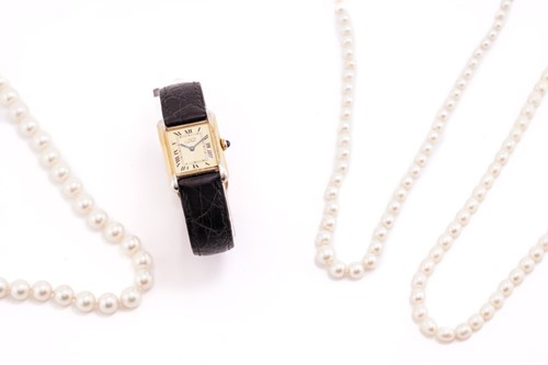 Lot 186 - A Must De Cartier tank watch and three strings...