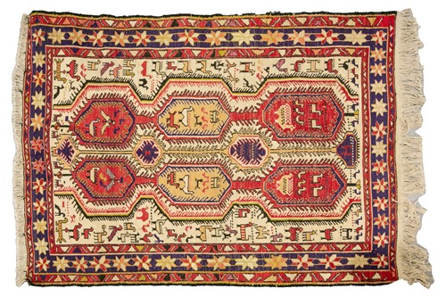 Lot 216 - A small ivory ground silk Soumak rug with...