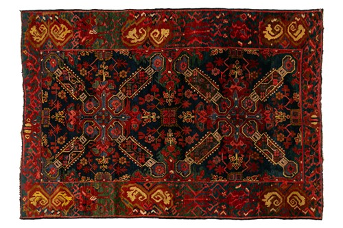 Lot 226 - An old dark blue ground Caucasian rug...