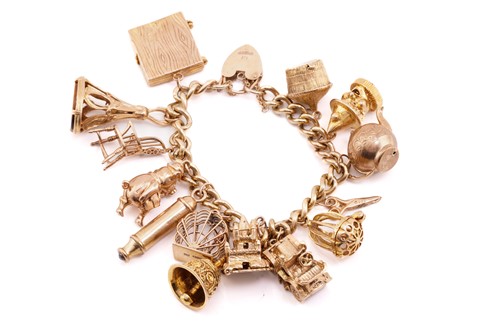 Lot 79 - A 9 carat gold charm bracelet; the curb...