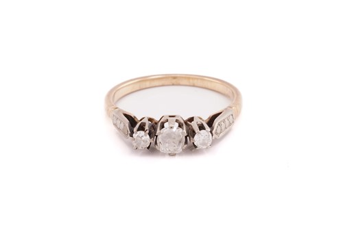 Lot 31 - A three stone diamond half hoop ring; the...