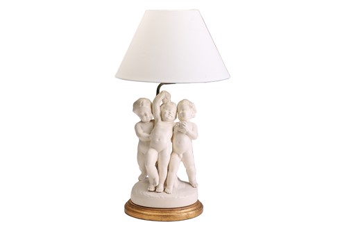 Lot 343 - A white glazed figural 'Cherub' table lamp,...