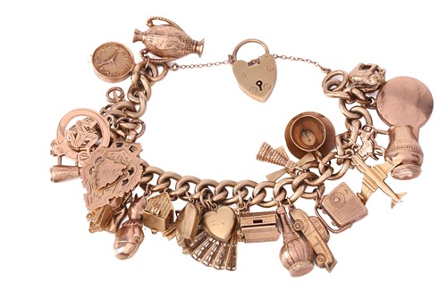 Lot 98 - A 9ct yellow gold charm bracelet, with 26...