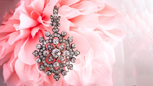Lot 105 - A Victorian floral pendant brooch set with old-...