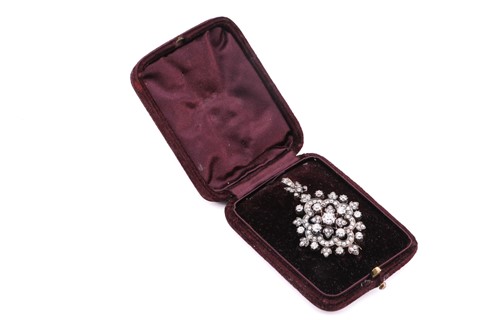 Lot 105 - A Victorian floral pendant brooch set with old-...