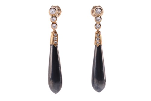 Lot 28 - A pair of hematite and diamond pendant...