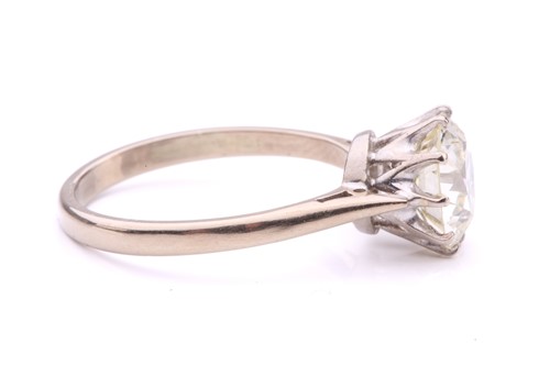 Lot 101 - A diamond solitaire ring, featuring a slightly...