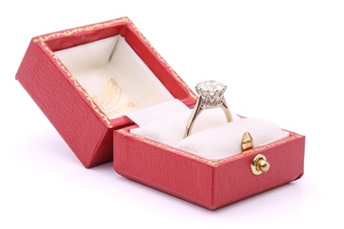 Lot 101 - A diamond solitaire ring, featuring a slightly...