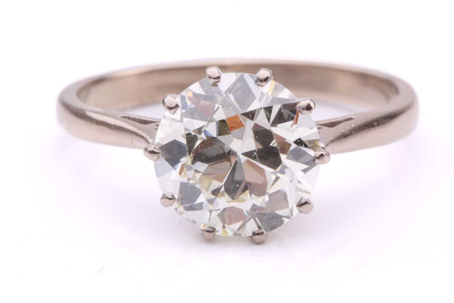 Lot 101 - A diamond solitaire ring, featuring a slightly...