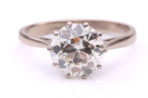Lot 101 - A diamond solitaire ring, featuring a slightly...
