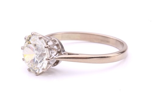 Lot 101 - A diamond solitaire ring, featuring a slightly...