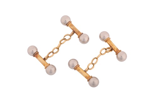 Lot 112 - A pair of two-toned cufflinks, in the form of...