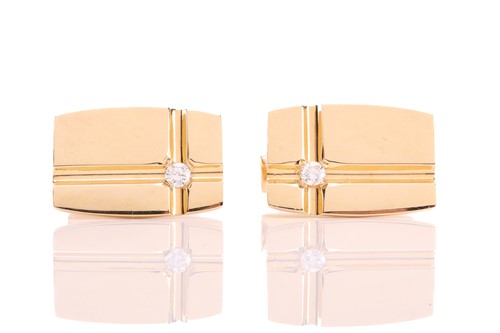 Lot 64 - A pair of cufflinks with diamond accents, each...