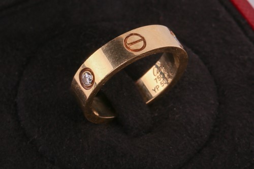 Lot 1 - Cartier - 'Love' ring, the polished band set...