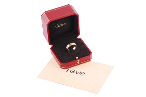 Lot 1 - Cartier - 'Love' ring, the polished band set...