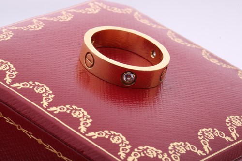 Lot 1 - Cartier - 'Love' ring, the polished band set...