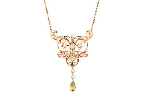 Lot 265 - An Edwardian peridot and seed pearl pendant...