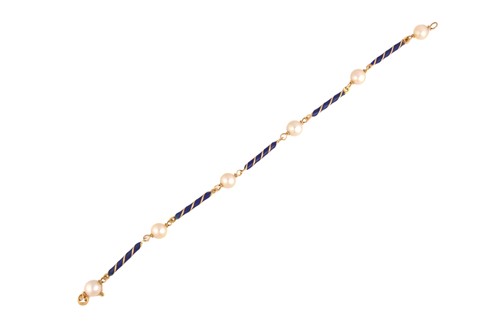 Lot 262 - A blue enamel and pearl bracelet, the...