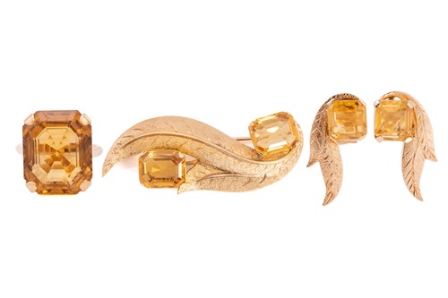 Lot 48 - A citrine brooch, matching earrings and a ring...
