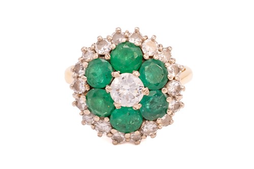 Lot 14 - An emerald and diamond cluster ring, centred...