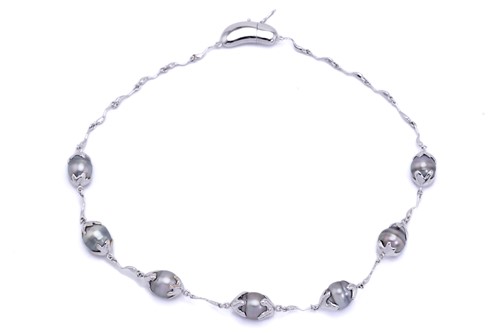 Lot 144 - A Tahitian pearl necklace, composed of seven...