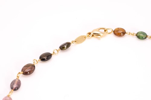 Lot 57 - A multi-gem bead necklace in 18ct yellow gold,...