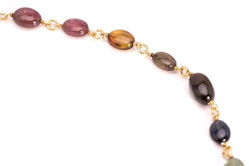 Lot 57 - A multi-gem bead necklace in 18ct yellow gold,...