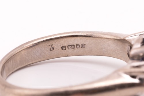 Lot 177 - A three-stone sapphire and diamond ring in...