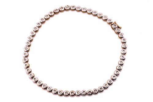 Lot 71 - A diamond set tennis bracelet, the round...