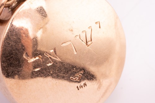 Lot 58 - A gem-set perfume bottle charm, one side of...
