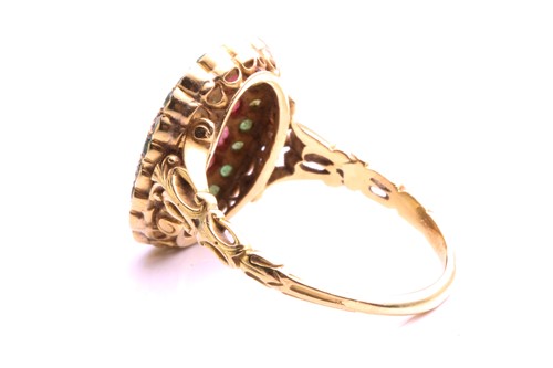 Lot 8 - A yellow metal, ruby, emerald, and opal dress...