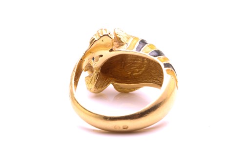 Lot 1 - An enamel tiger head ring, composed of striped...
