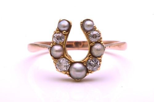 Lot 320 - A split pearl and diamond horseshoe ring,...