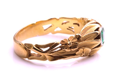 Lot 5 - A floral engraved dress ring set with an...