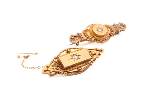 Lot 12 - Two Etruscan Revival diamond-set brooches in...