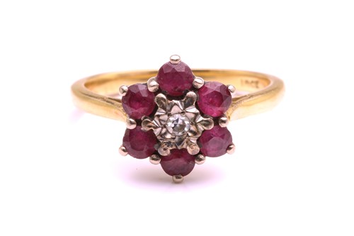 Lot 302 - A yellow metal, diamond, and ruby floral...