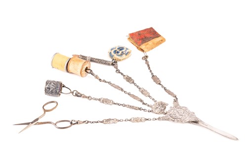 Lot 460 - An Edwardian cast silver four-chain Chatelaine,...