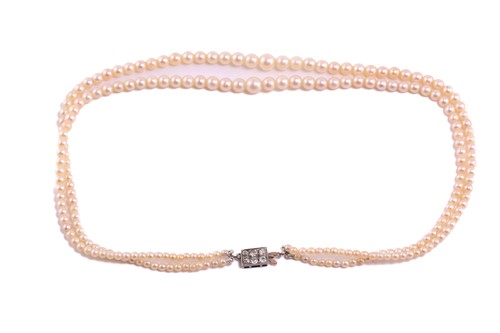 Lot 23 - A graduated two-row cultured pearl necklace...