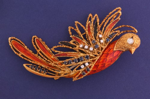 Lot 22 - A sapphire and diamond phoenix brooch set in...