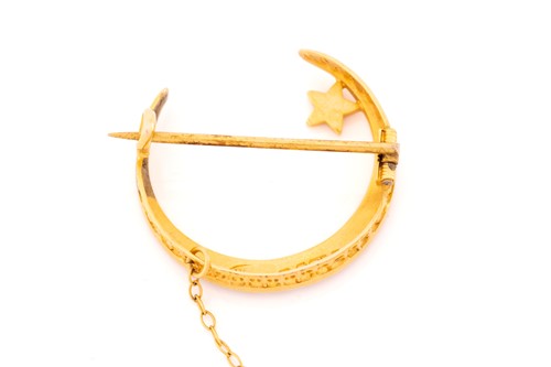 Lot 56 - A late Victorian 15 carat gold crescent brooch,...