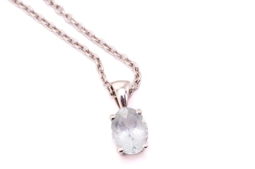 Lot 31 - A 9ct white gold and single stone aquamarine...