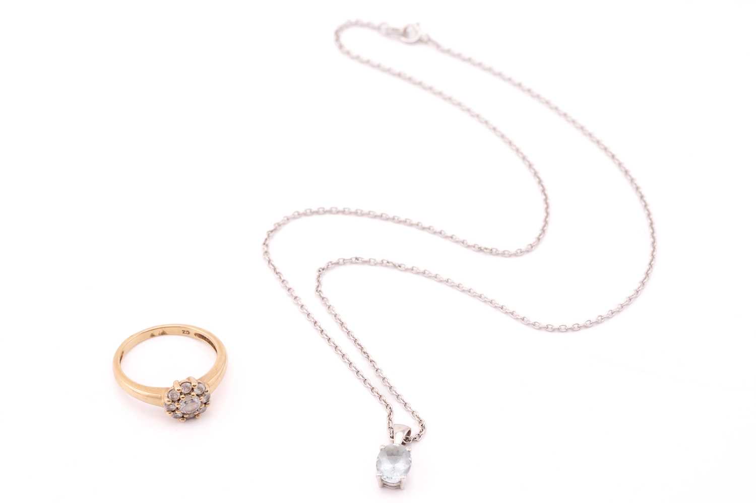 Lot 31 - A 9ct white gold and single stone aquamarine...